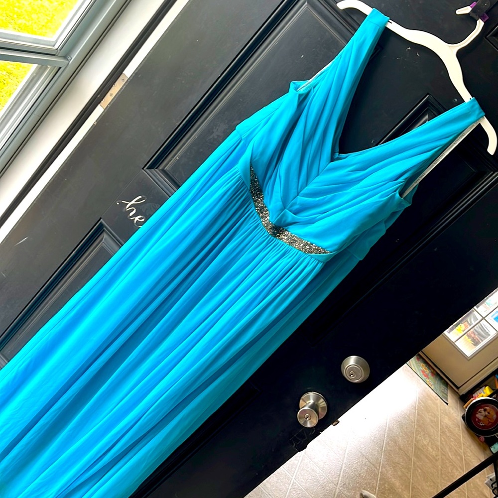 Teal bridesmaid dress. Silver beading. Sleeveless. Very flattering.